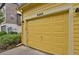 Exterior view of a yellow garage door at 8260 E 24Th Dr, Denver, CO 80238