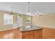 Open concept kitchen with island that provides seating, storage and countertop space at 8260 E 24Th Dr, Denver, CO 80238