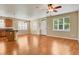 Spacious living area with hardwood floors, ample natural light, and a kitchen island at 8260 E 24Th Dr, Denver, CO 80238