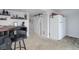 Basement bar area with bar stools and mini-fridge at 11575 Crow Hill Dr, Parker, CO 80134