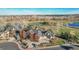 Luxury home with a golf course and pond in the background at 5960 S Watson Ln, Littleton, CO 80123