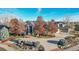 Luxury home with a large driveway and beautiful landscaping at 5960 S Watson Ln, Littleton, CO 80123