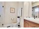 Well-appointed bathroom with a toilet, sink, and shower at 5960 S Watson Ln, Littleton, CO 80123