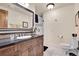 Elegant bathroom with dark wood vanity and a walk-in shower at 5960 S Watson Ln, Littleton, CO 80123