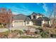 Spacious home with three-car garage and manicured landscaping at 5960 S Watson Ln, Littleton, CO 80123