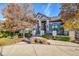 Stunning two-story home with stone accents and manicured landscaping at 5960 S Watson Ln, Littleton, CO 80123