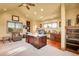 Bright home office features built-in shelves and large windows at 5960 S Watson Ln, Littleton, CO 80123