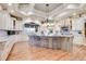 Gourmet kitchen with large island, custom cabinetry, and granite counters at 5960 S Watson Ln, Littleton, CO 80123