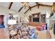 Large living area with comfortable seating and built-in shelving at 5960 S Watson Ln, Littleton, CO 80123