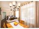 Bright dining area with hardwood floors and chandelier, adjacent to kitchen at 12711 Colorado Blvd # 912, Thornton, CO 80241