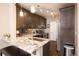 Modern kitchen with granite countertops and stainless steel appliances at 12711 Colorado Blvd # 912, Thornton, CO 80241