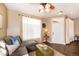 Living room with hardwood floors, large window, and comfortable seating at 12711 Colorado Blvd # 912, Thornton, CO 80241