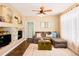 Cozy living room featuring a sectional sofa and a stone fireplace at 12711 Colorado Blvd # 912, Thornton, CO 80241