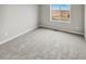 Bright bedroom with soft carpet and a window offering outdoor views at 2175 Alyssa St, Fort Lupton, CO 80621