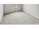 Cozy bedroom featuring plush carpet and natural light from a window at 2175 Alyssa St, Fort Lupton, CO 80621