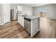 A modern kitchen island with granite countertops, stainless steel dishwasher, and ample cabinet space at 2175 Alyssa St, Fort Lupton, CO 80621