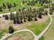 Stunning aerial view showcases meadows, winding paths, clusters of trees, and a nearby sandy creek bed at 2470 Driftwood, Elizabeth, CO 80107