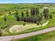 Overhead shot featuring a pond, green pastures, and clusters of trees, highlighting the property's natural landscape at 2470 Driftwood, Elizabeth, CO 80107