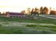 Exterior view of a red barn with horses grazing in the surrounding field at 2470 Driftwood, Elizabeth, CO 80107