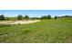 Expansive green landscape with clear blue skies, with pasture and trees in the background at 2470 Driftwood, Elizabeth, CO 80107