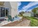 Backyard featuring a patio with chairs and a view of the lawn and greenery at 15976 E Radcliff Pl # A, Aurora, CO 80015