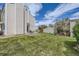 Spacious backyard with green lawn and patio area, perfect for outdoor entertaining at 15976 E Radcliff Pl # A, Aurora, CO 80015