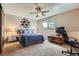 Cozy bedroom with neutral tones, a ceiling fan, and comfortable furnishings at 15976 E Radcliff Pl # A, Aurora, CO 80015
