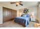 Comfortable bedroom with a queen bed, and closet space at 15976 E Radcliff Pl # A, Aurora, CO 80015