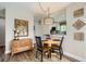Eat-in dining area with modern decor and a view into the kitchen, and a small storage cabinet at 15976 E Radcliff Pl # A, Aurora, CO 80015