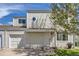 Charming two-story home featuring a well-maintained front yard and a cozy, inviting entrance at 15976 E Radcliff Pl # A, Aurora, CO 80015
