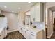 Spacious kitchen featuring lots of countertop space and modern white cabinets at 15976 E Radcliff Pl # A, Aurora, CO 80015