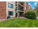 Condo backyard with lawn, patios and balconies at 401 S Kalispell Way # 104, Aurora, CO 80017