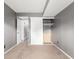 Neutral bedroom with carpet, gray walls, and a closet, offering a serene and comfortable space at 401 S Kalispell Way # 104, Aurora, CO 80017