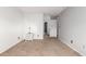 Bedroom with tan carpet, light gray walls and white trim at 401 S Kalispell Way # 104, Aurora, CO 80017