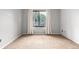 Cozy bedroom with a window and tan carpet at 401 S Kalispell Way # 104, Aurora, CO 80017