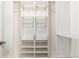 Organized closet with built-in shelving, rods, and drawers, providing ample storage space at 401 S Kalispell Way # 104, Aurora, CO 80017