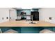 Inviting kitchen with breakfast bar, stylish cabinets and bright lighting at 401 S Kalispell Way # 104, Aurora, CO 80017