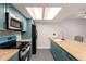 Updated kitchen features modern appliances, stylish countertops and ample cabinet space at 401 S Kalispell Way # 104, Aurora, CO 80017