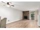 Bright living room showcases a stone fireplace and new flooring at 401 S Kalispell Way # 104, Aurora, CO 80017