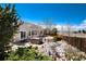 Beautifully landscaped backyard featuring a hot tub, a charming stream and mature greenery at 11302 Mesa Verde Pl, Parker, CO 80138