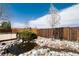 Landscaped backyard featuring a charming pond, mature trees and privacy fence at 11302 Mesa Verde Pl, Parker, CO 80138