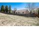 Expansive backyard featuring mature trees, a privacy fence and plenty of space for outdoor activities at 11302 Mesa Verde Pl, Parker, CO 80138