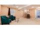 Relaxing basement area with seating, carpet, and staircase to the upper level at 11302 Mesa Verde Pl, Parker, CO 80138
