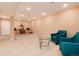 Finished basement provides ample space, neutral carpet, and two plush chairs at 11302 Mesa Verde Pl, Parker, CO 80138
