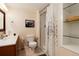 Well-lit bathroom with a shower stall, a patterned curtain, vanity and modern fixtures at 11302 Mesa Verde Pl, Parker, CO 80138