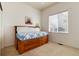 Bright bedroom offering a trundle bed, natural light, and neutral carpet at 11302 Mesa Verde Pl, Parker, CO 80138