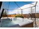 Relaxing backyard hot tub with a metal gazebo, rock landscaping, and a privacy fence at 11302 Mesa Verde Pl, Parker, CO 80138