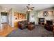 Inviting living room featuring built-in shelves, a fireplace, and a comfortable seating area at 11302 Mesa Verde Pl, Parker, CO 80138