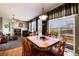 Open-concept living space with wood floors, fireplace, and an adjacent dining area at 11302 Mesa Verde Pl, Parker, CO 80138