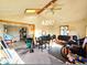 Great room inside the ADU featuring exposed beam ceiling and a connected room at the far end at 8 Sioux Trl, Evergreen, CO 80439